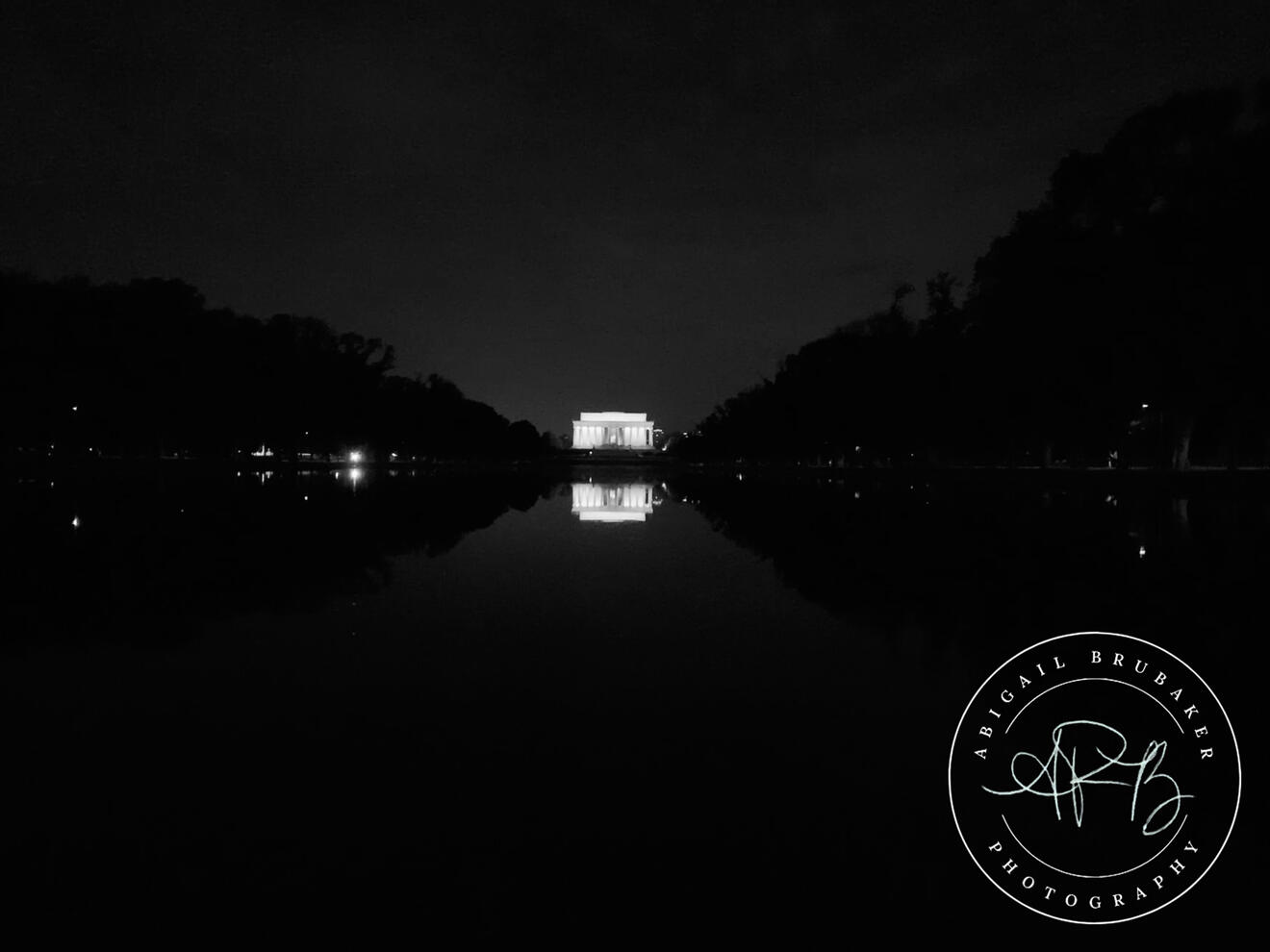 The Lincoln Reflecting In The Pool At Night